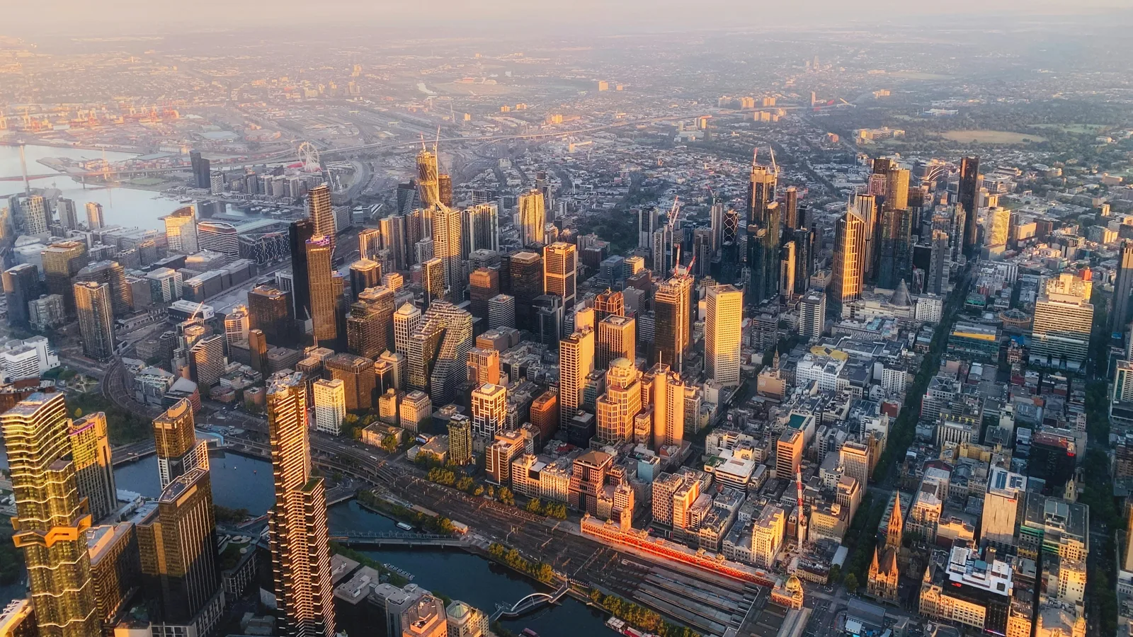 Melbourne VIC, Australia; golden-hour aerial city buildings